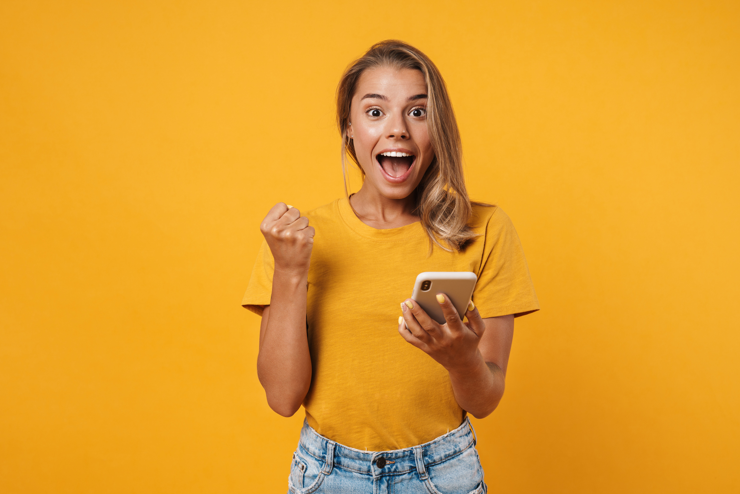 Portrait of a Happy Cheerful Woman Celebrating Success